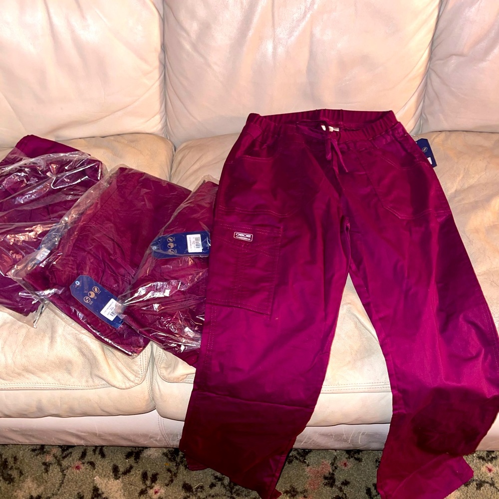 4 pair of wine colored scrub pants, brand new. Size small tall